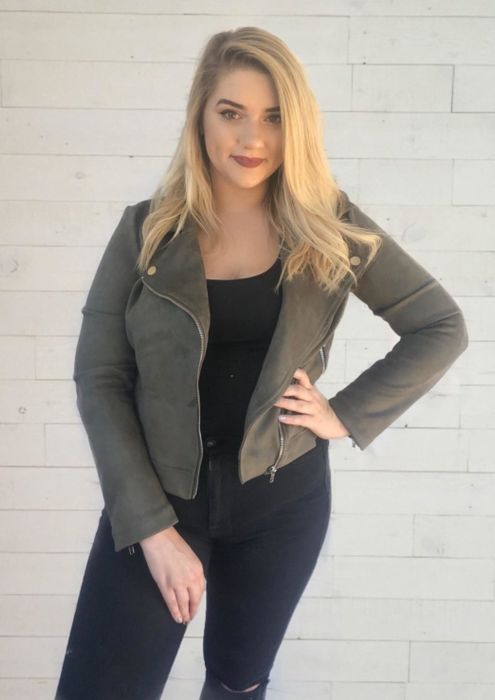 A different reviewer showcasing the coat in a stylish army green color.