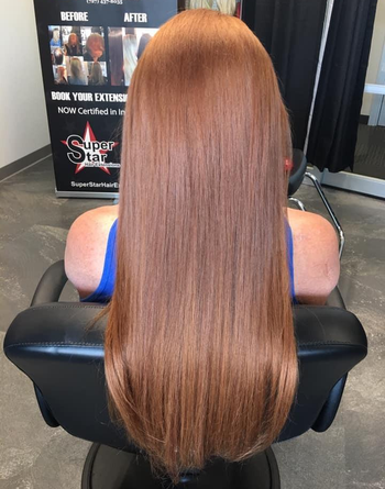 A reviewer with long, glossy, and smooth-looking hair