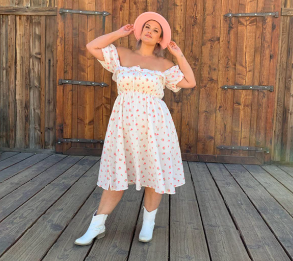 A customer review photo of them in the white floral print midi dress.