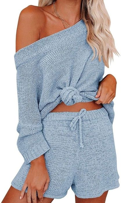 A model is shown from the front wearing the light blue set with the top tied in a knot.