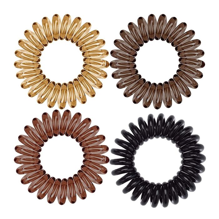 Four coiled hair ties in different shades of brown