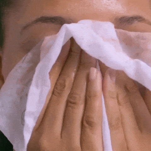 Model patting her face dry, revealing a fresh, clean complexion