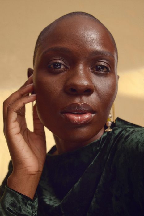model wearing the skin tint in the shade Rich 1