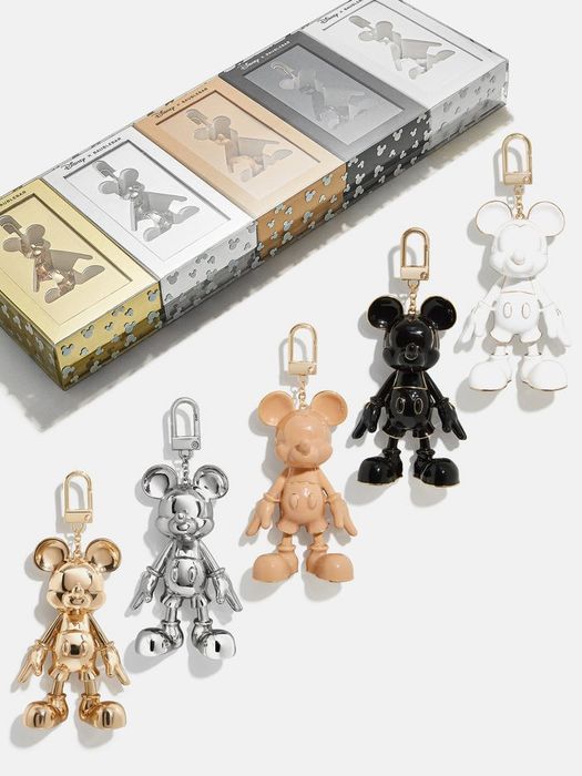 a gold, silver, tan, black, and white Mickey Mouse keychain from BaubleBar