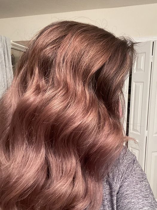 A reviewer reveals their hair after applying an argan oil mask.