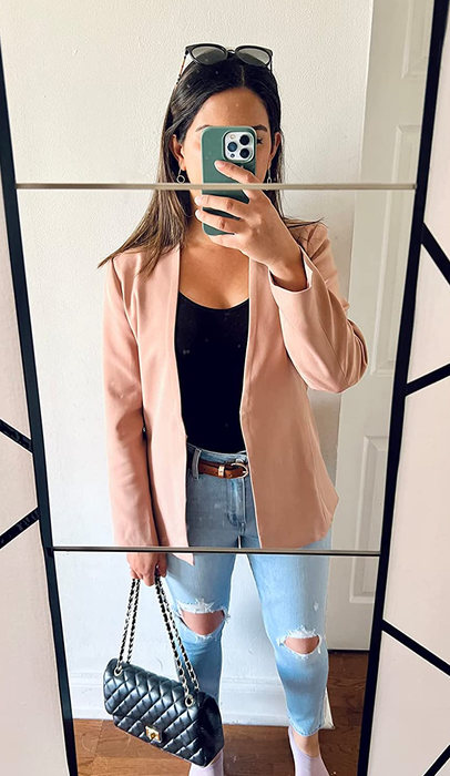 A reviewer wearing the blazer in tan.