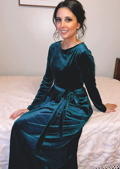 Reviewer dressed in a dark green velvet gown.