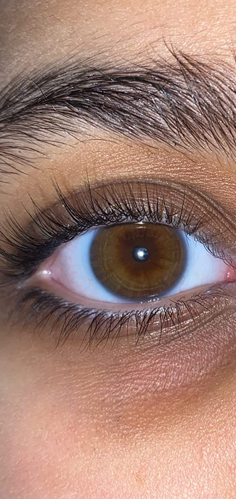 Close-up of a reviewer's long, wispy lashes after using the separator comb