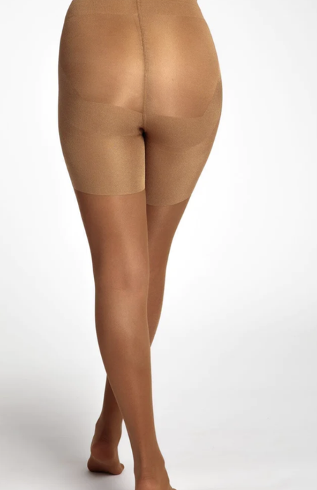 A model showcasing the nude tights, demonstrating their flawless fit and elegant appearance.