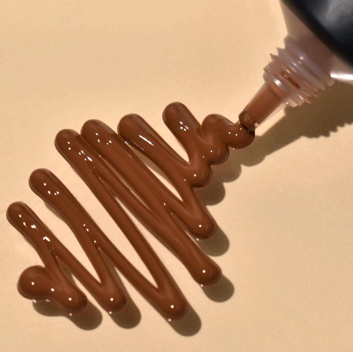 the product being dispensed from its tube