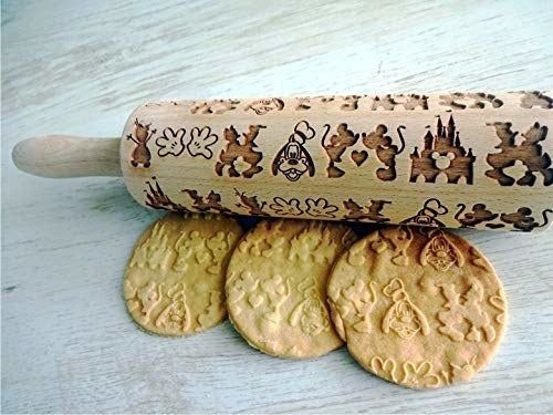 a rolling pin featuring images of Mickey, Minnie, Goofy, and the castle
