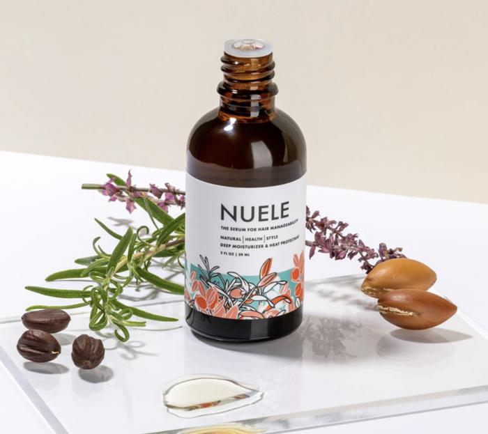 A bottle of Nuele Hair Serum