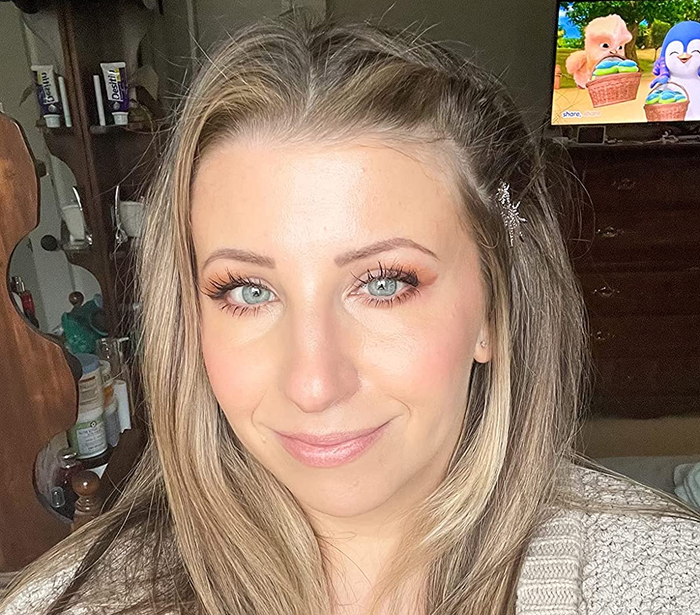 Another reviewer showcasing their makeup look with the primer beneath it