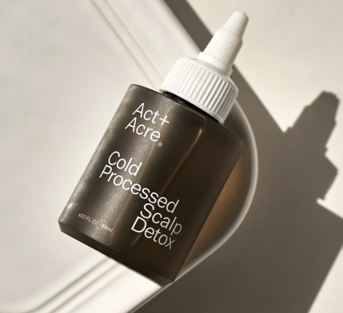 The brown bottle of cold-pressed scalp detox treatment