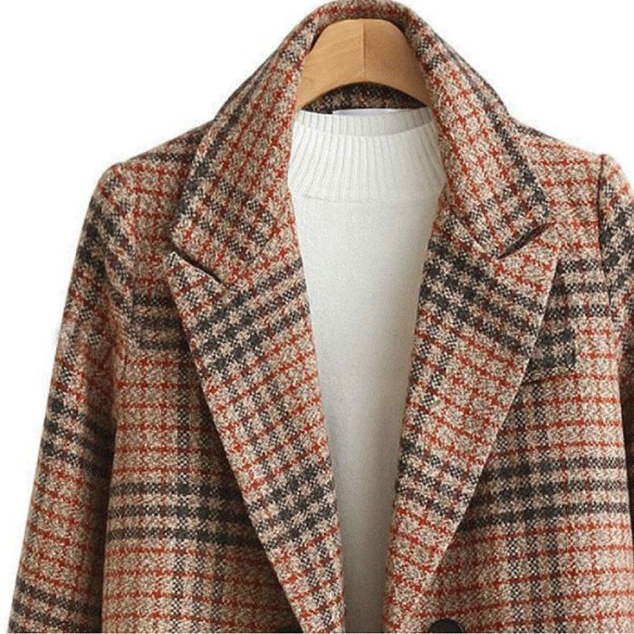 A close-up of the green plaid coat.