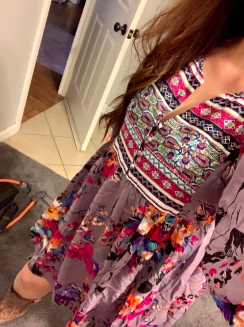 A customer review photo showcasing the bohemian tunic in a gray and pink combination.