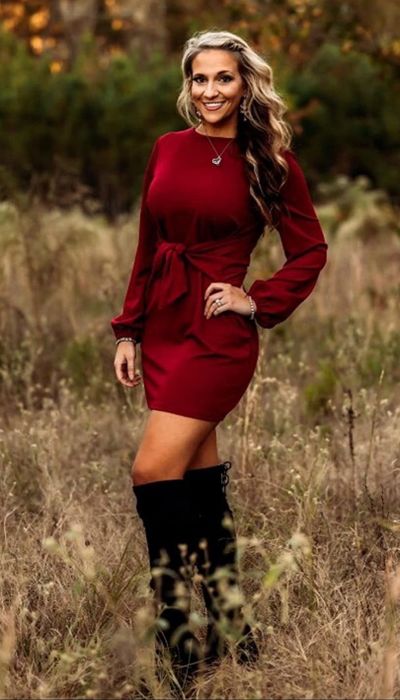 A reviewer showing off the dress in red.