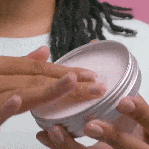 GIF of a model gently washing makeup off with cleanser