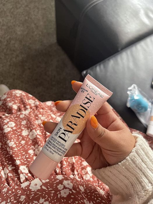 reviewer photo holding the product tube