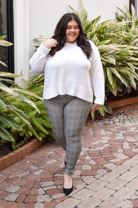 A photo of a reviewer wearing the jeggings in glen plaid.