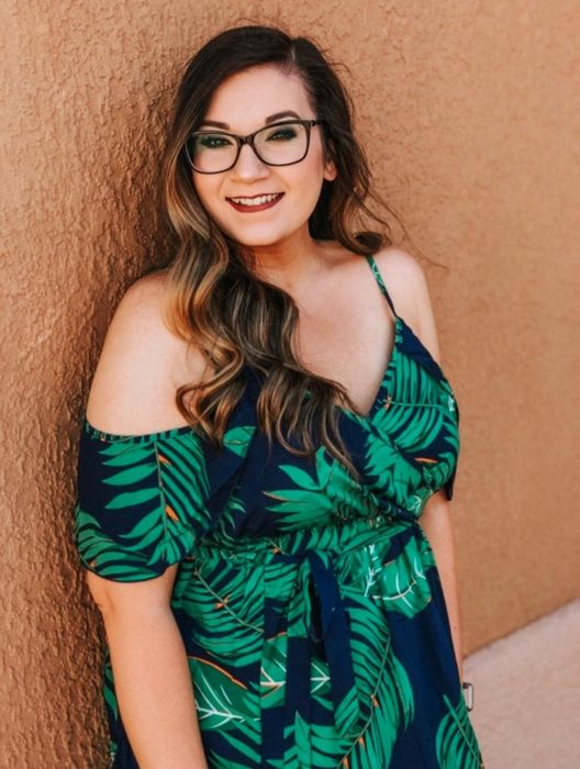 A reviewer modeling the dress.