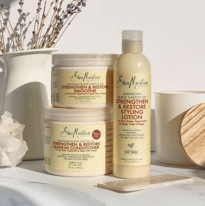A jar of leave-in conditioner, hair smoothie, and a styling lotion