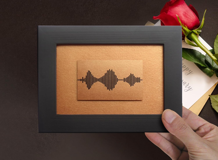 Black-framed sound wave print of