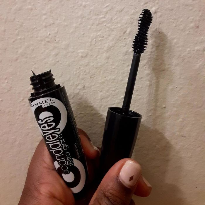 A reviewer presenting the mascara.