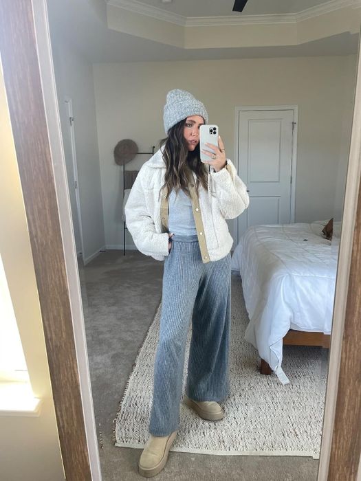 A reviewer rocking the grey pants, showcasing a relaxed yet stylish look.