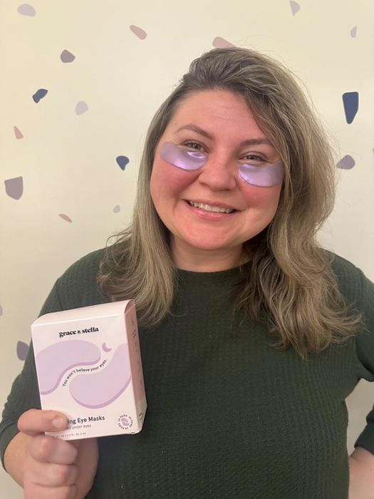 Reviewer wearing under-eye masks