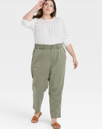 model wearing the green high-rise pants