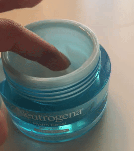 A gif showing a hand dipping into a jar of Neutrogena Hydro Boost cream and pulling out a small amount.