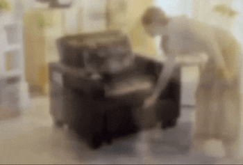 A model demonstrating how to pull out the hidden compartment at the bottom to convert it into a lounger.