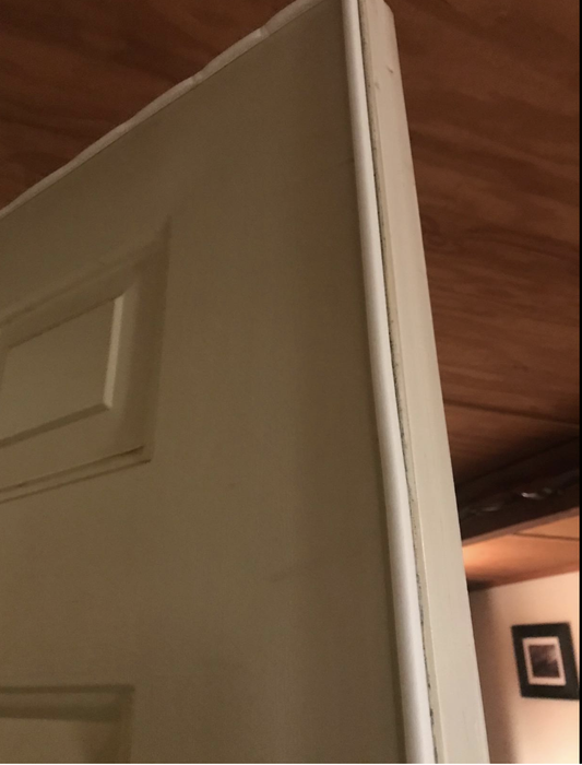 A reviewer shares a photo of the soundproofing strip installed on a door.