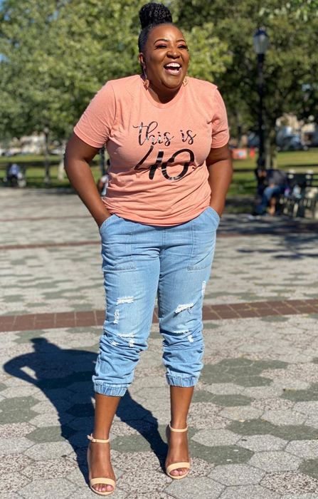 reviewer wearing the denim joggers cuffed to mid-calf