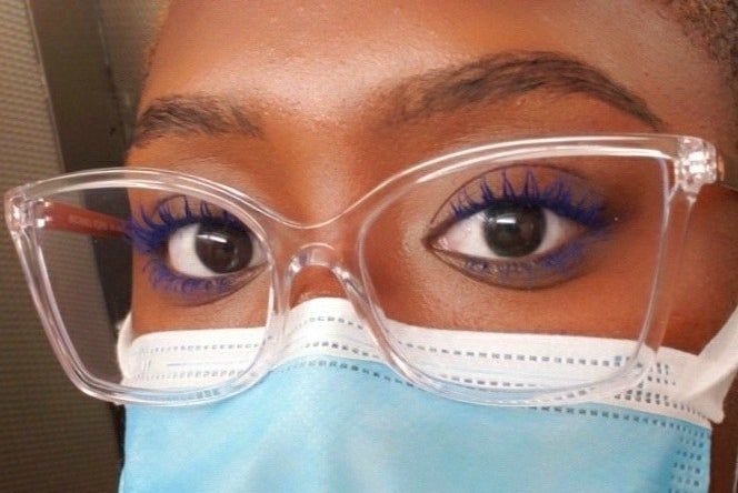 Customer applying the blue mascara