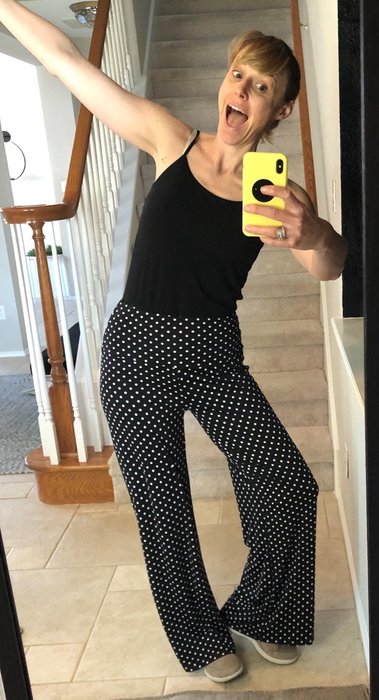 A reviewer rocking the black pants with white polka dots.