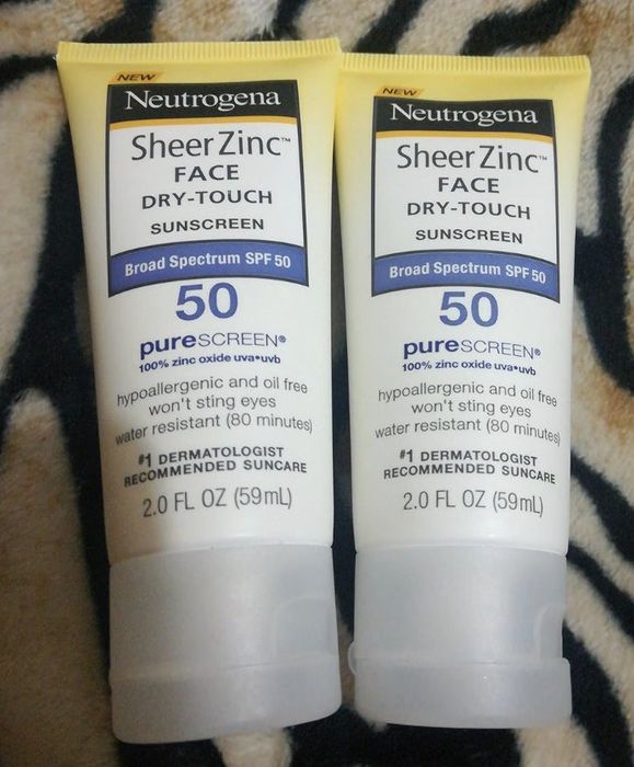 Two bottles placed gently on a textured surface.
