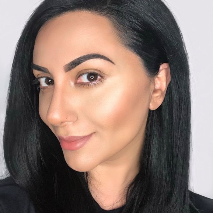 A reviewer showing off their beautifully glowing skin.