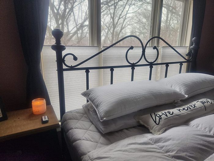 A reviewer's bed with two Beckham Hotel Collection pillows placed neatly on top
