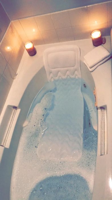 the pillow floating in a tub filled with water