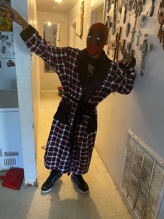 Reviewer in a red and white plaid robe