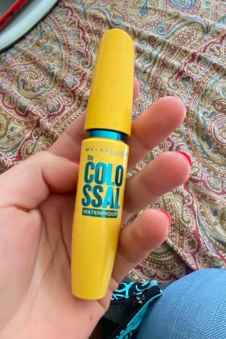 Customer holding the mascara