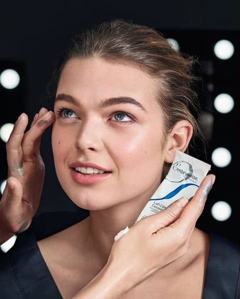 Model applying Embryolisse Lait-Crème Concentré to another model's face