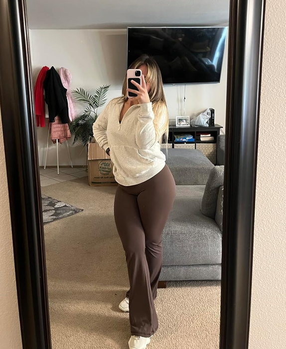 Reviewers sporting the dark brown flared leggings, demonstrating their versatile style