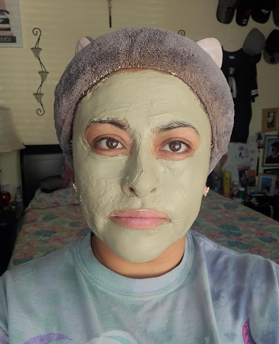 reviewer with the mask applied to their face