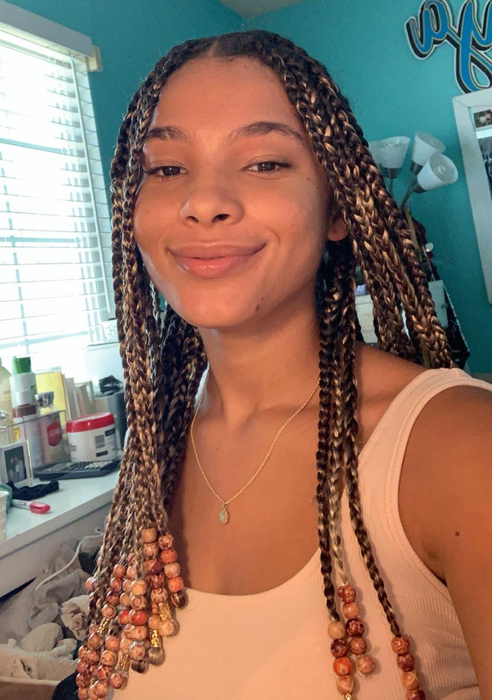 reviewer showcasing clear skin