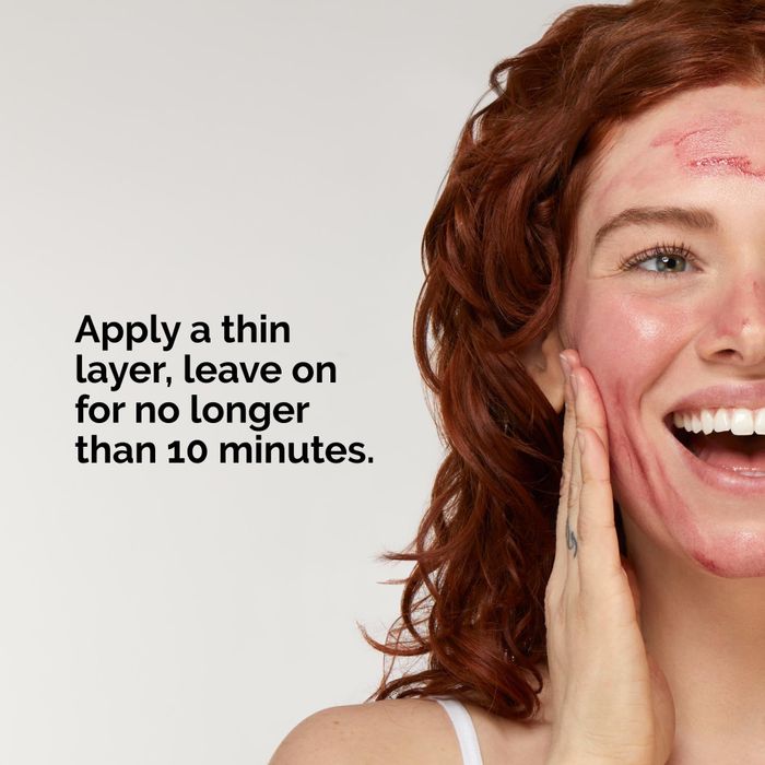 A model applies a thin layer of the product to their face, with an instruction to leave it on for no more than 10 minutes.