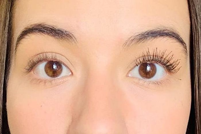 Customer wearing the mascara on one eye