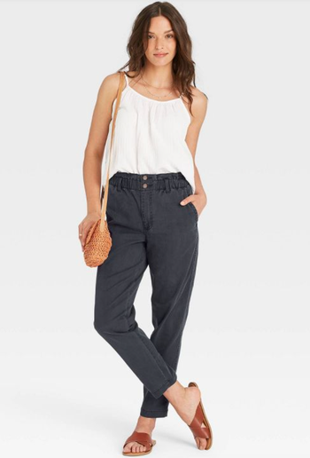 model wearing the black high-rise pants